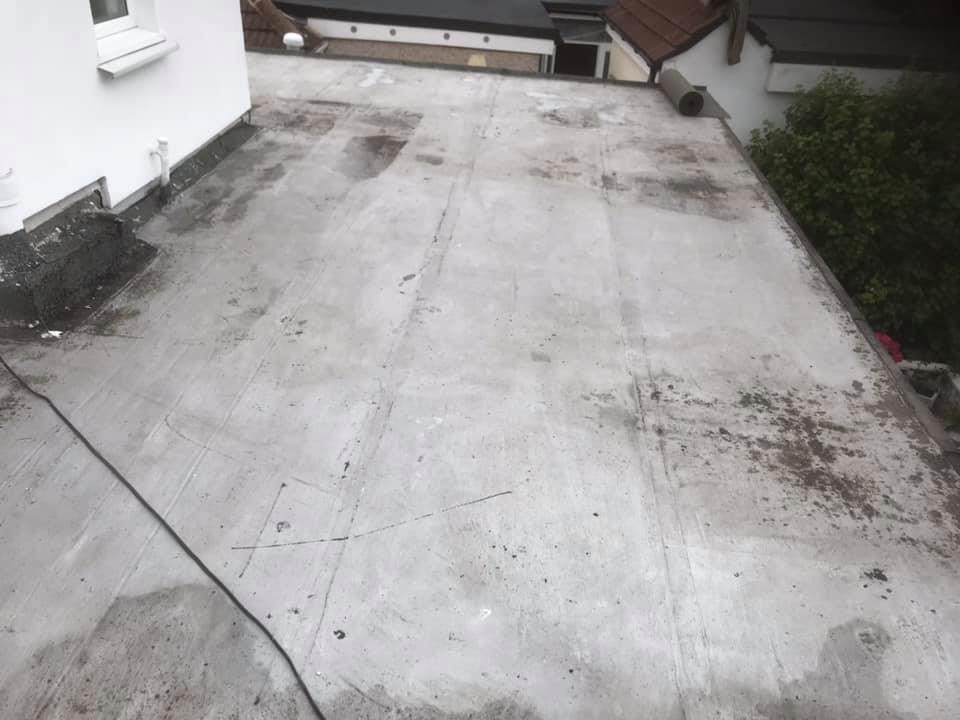 1. Existing felt stripped and decking in need of replacement