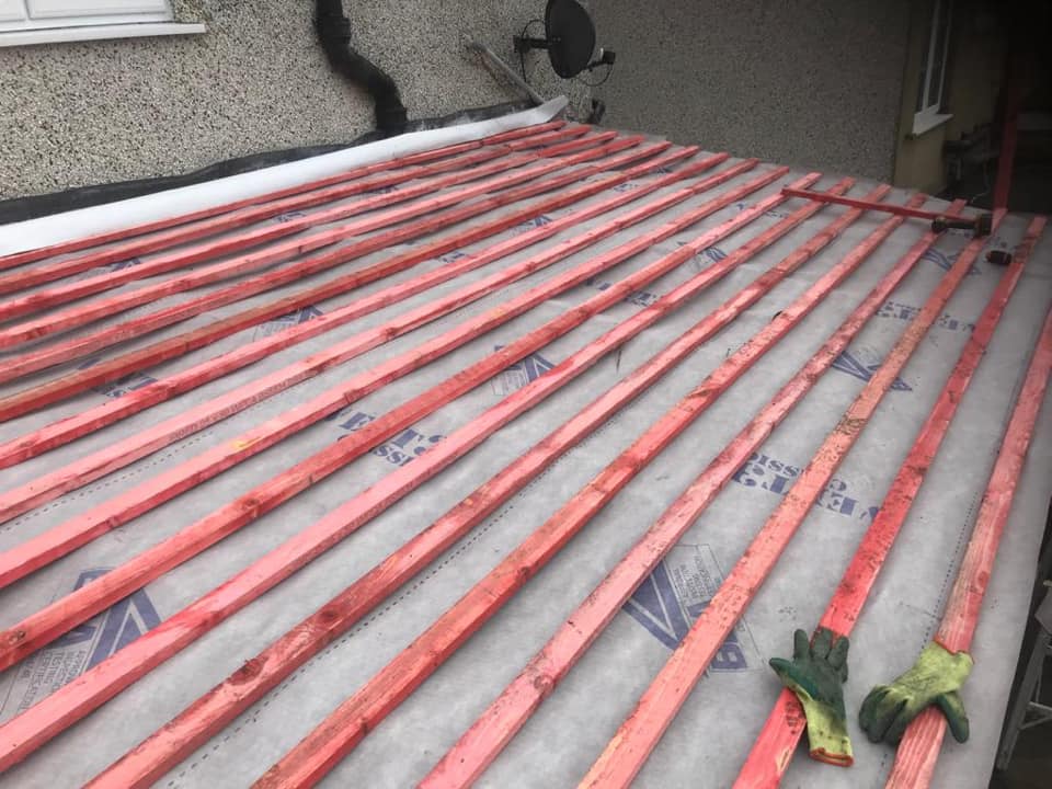 2. Chesnut Brown Tapco Slate Roof During